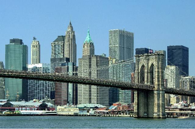Brooklyn Bridge from the East River with views of downtown Manhattan photo