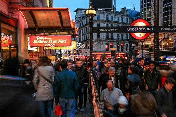 Image of people in London’s West End on a rainy day