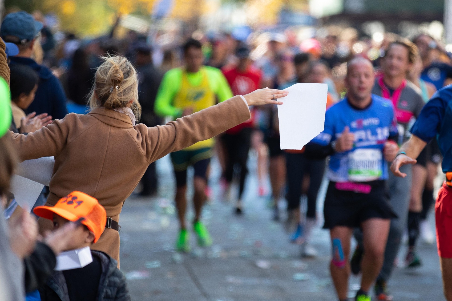 New York City Marathon supporters encourage runners from the sidelines. [Photo credit: Michael Kastelic/Pixabay]
