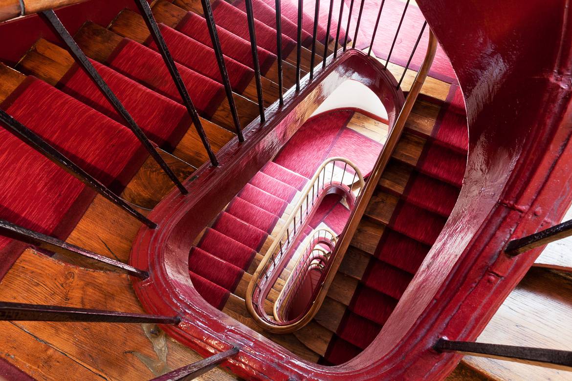 Red stairs to Paris apartment