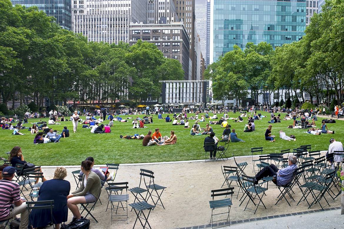 Eager movie-goers gather on the lawn at Bryant Park for outdoor screenings.