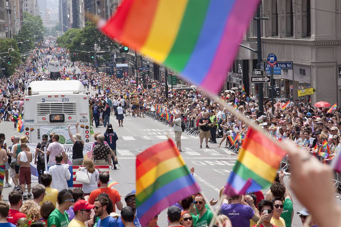 New Yorkers along 5th Avenue show pride and solidarity with the LGBTQ community.