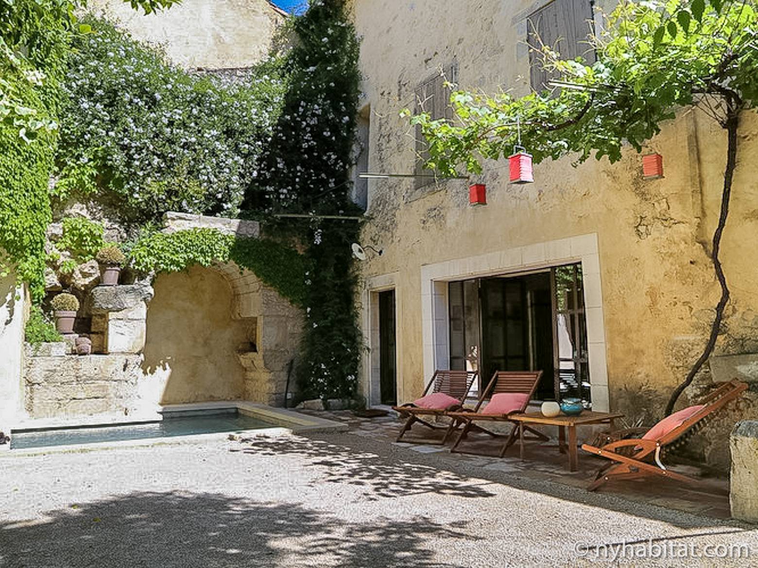 Image of a poolside garden terrace