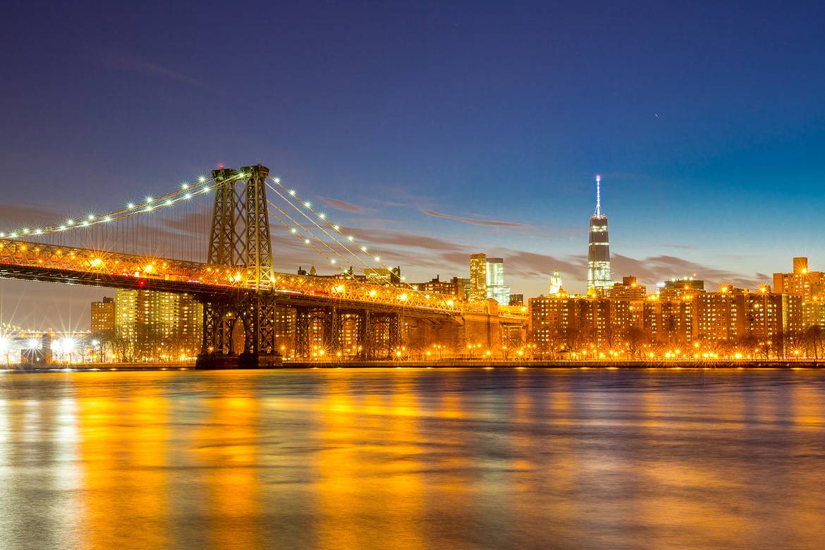 A river view south towards the Williamsburg Bridge and One World Trade Center.