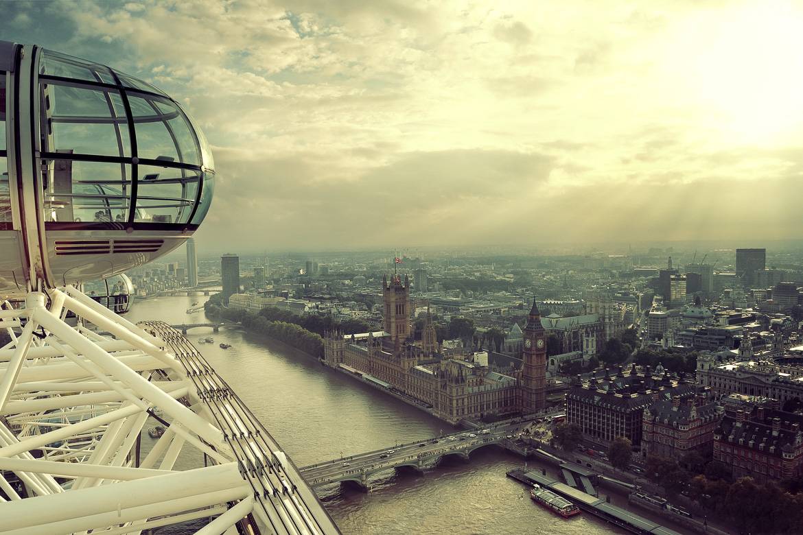 Image of the London Eye Ferris Wheel backed by the River Thames and Westminster