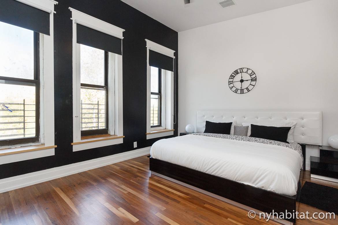 Image of a bedroom with window guards on the windows