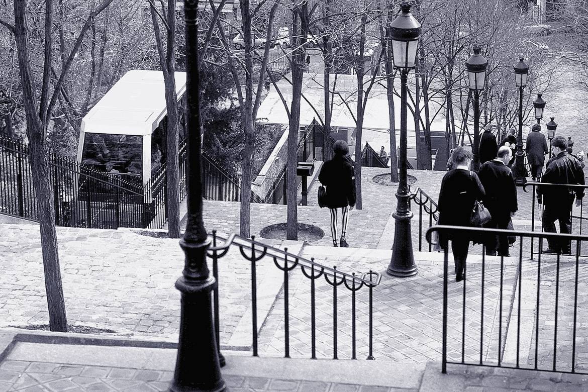 Image of the stairs and funicular train up to Montmartre in black and white