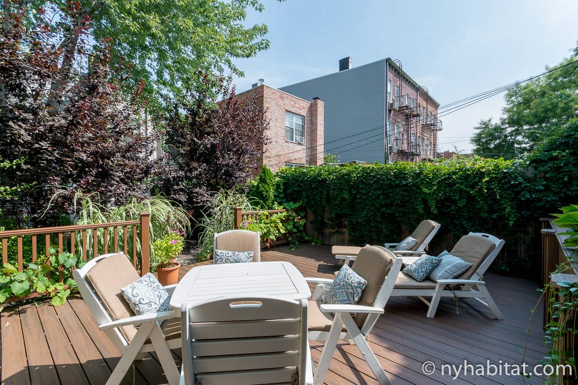Image of a patio deck with lounge chairs on a sunny day