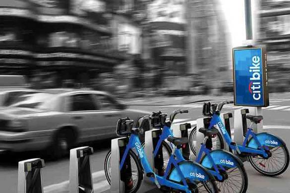 Image of Citi Bike station in Manhattan with taxis and NYC streets in the background