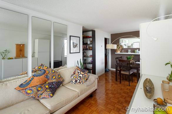 Image of stylish main room of shared apartment NY-15891 with couch and dining table