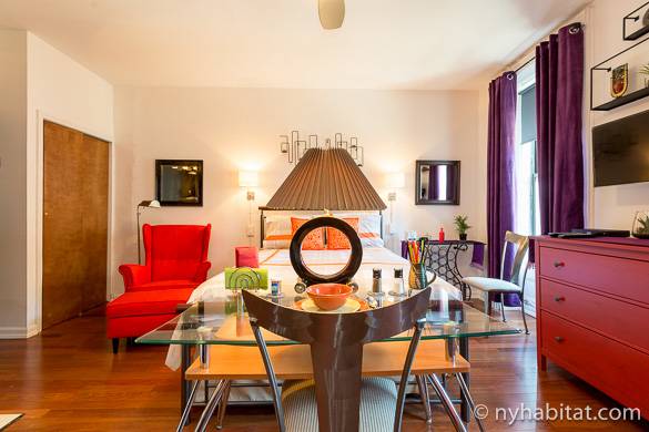 Image of the colorfully decorated main room in NY-16336, with a queen-size bed