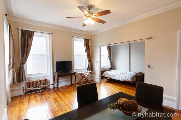 Picture of living room of studio apartment NY-16171 with sleeping alcove in the back