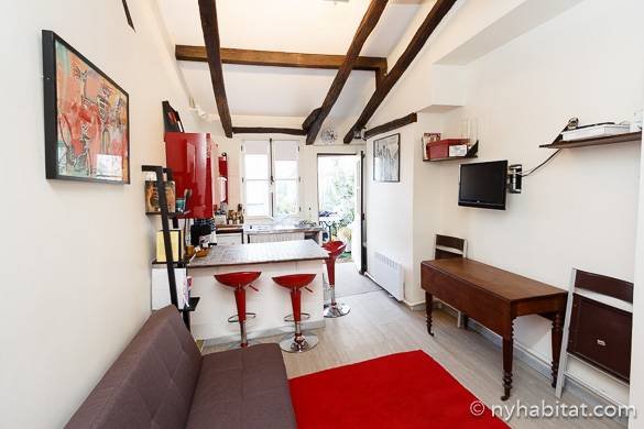 Image of living room of PA-16115 with red bar stools and exposed wood beam ceilings