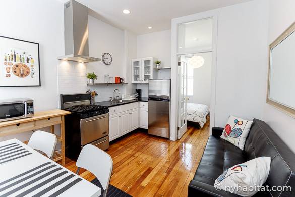 Image of kitchen and living room sofa and dining table of apartment NY-16210 in Ridgewood Queens