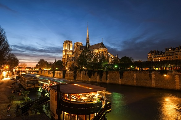 Image of boat on the Seine with Notre Dame cathedral in the background