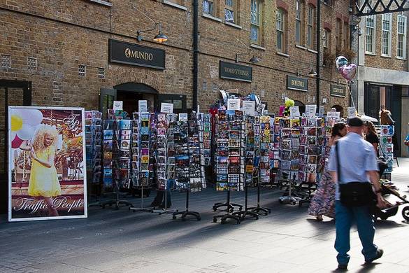 Image of street market shops with postcard stands