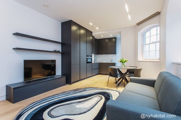 Image of living room of LN-1806 with couch, rug and flat screen TV