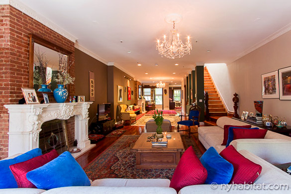 image of a large living room in NY-15146, with colorful cushions in the foreground