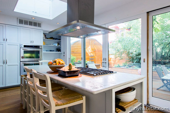 view of the kitchen in NY-15856, with a patio visible through the sliding door
