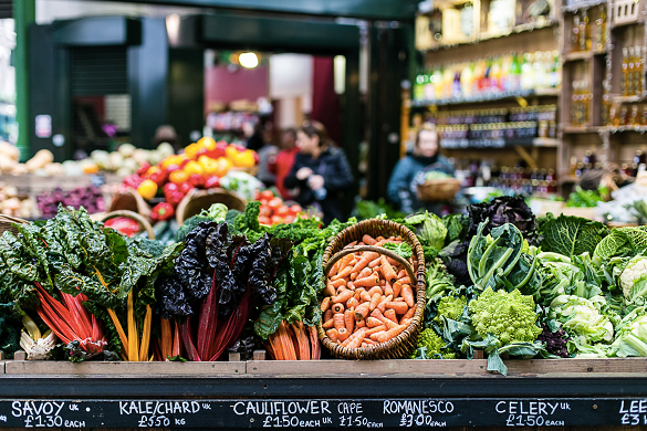 Image of produce stalls in an outdoor market