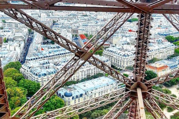 Image of view from atop the Eiffel Tower looking down on Haussmannian buildings below