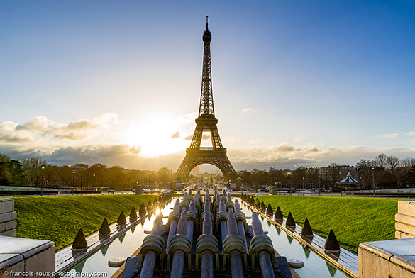 Image of Eiffel Tower with sun setting behind it