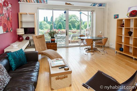 Image of living room of LN-1000 with balcony overlooking gardens