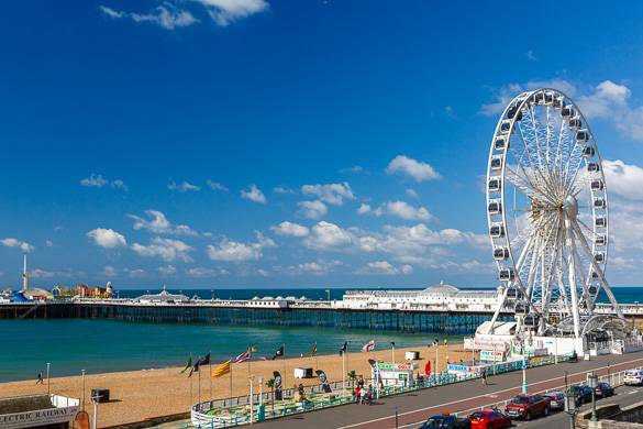 Image of sea and boardwalk with Ferris wheel in Brighton, England