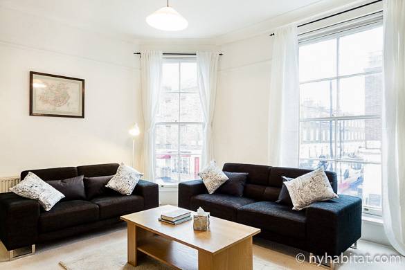 Image of living room of LN-1080 in Paddington with windows overlooking the street