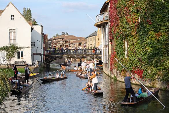 Image of tourists being rowed in boats on the River Cam in Cambridge, England
