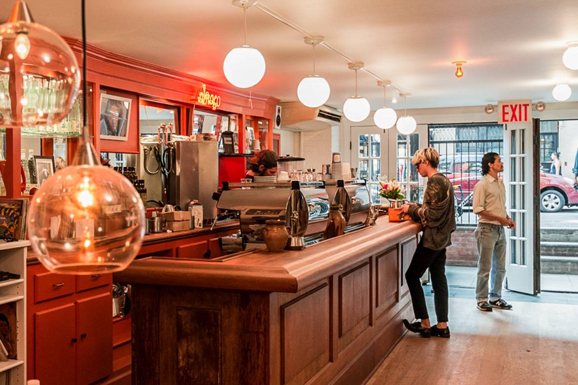 Image of person getting coffee at the counter of Abraco Espresso bar