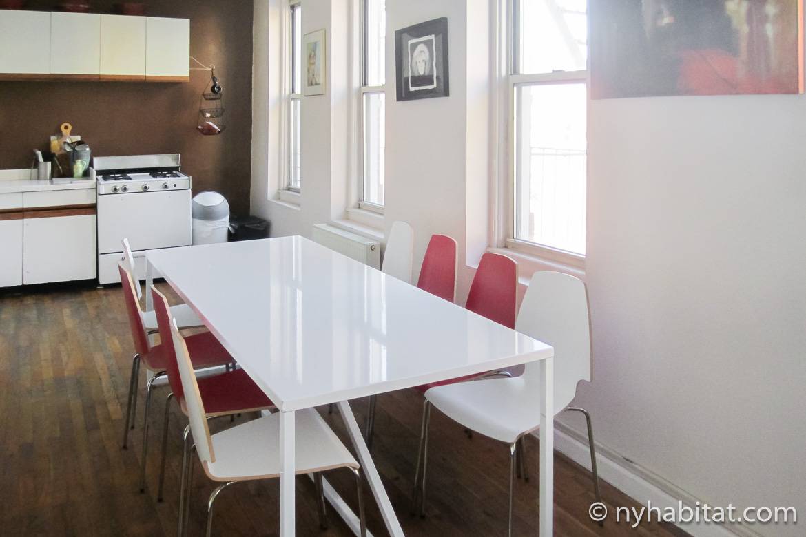 Image of kitchen of NY-14846 with white cabinets and gas stove with oven