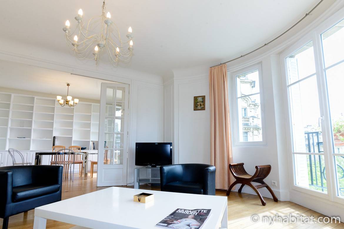 Image of living room of PA-2668 with balcony and lots of windows