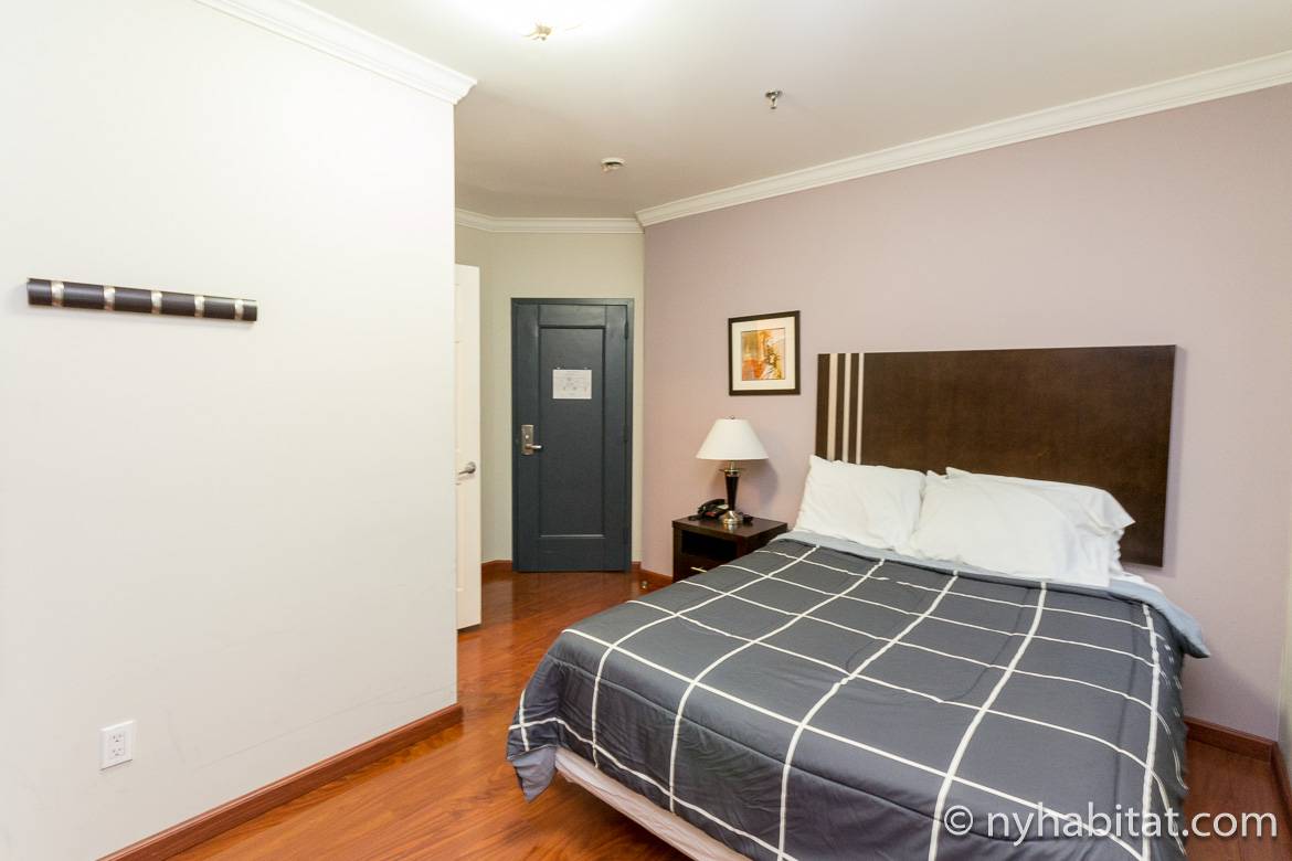 Image of a room with two double beds and a private bathroom in a dormitory-style building on the Upper West Side (NY-14890)
