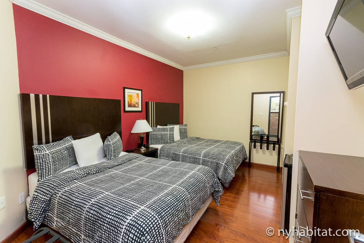 Image of a room with two double beds in a dormitory-style building on the Upper West Side (NY-14889)