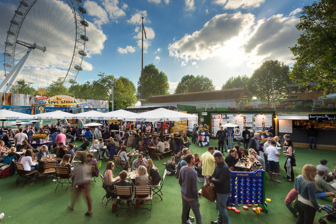Image of Underbelly Festival with amusement rides and food vendors