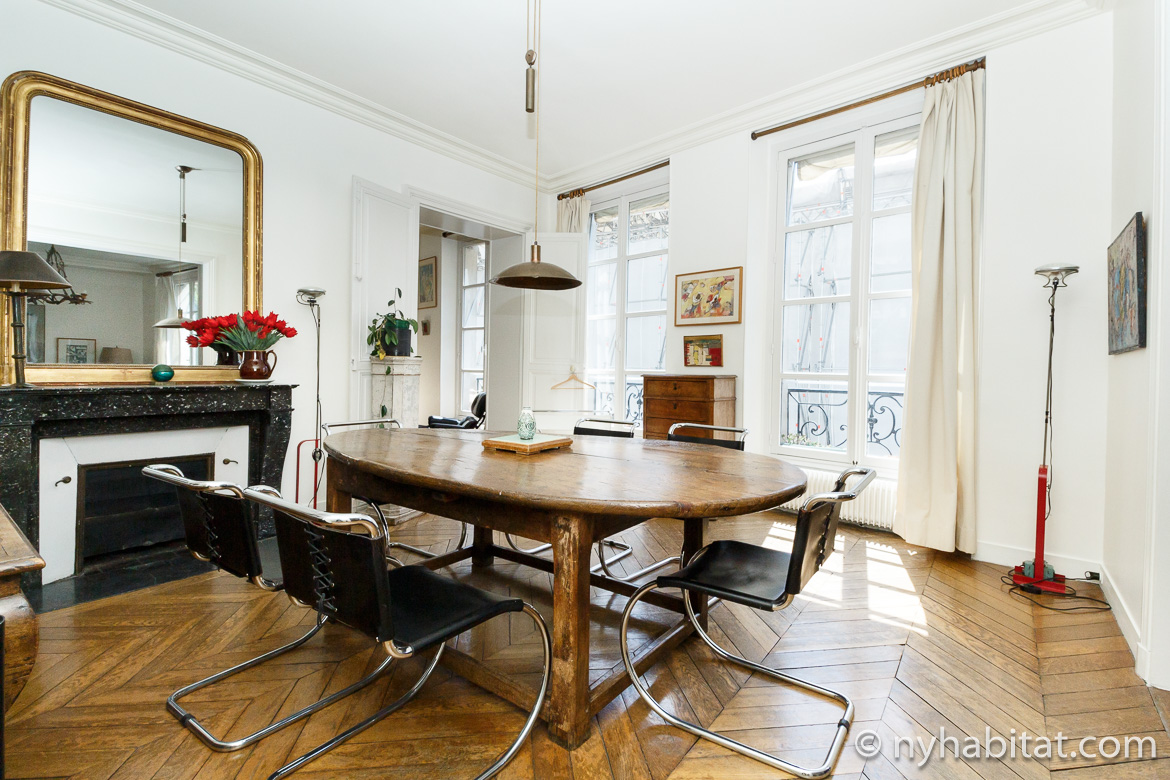 Image of dining table and decorative fireplace in apartment rental PA-2278