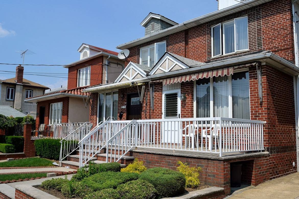 Image of 2-story brick homes in a Queens neighborhood in New York.