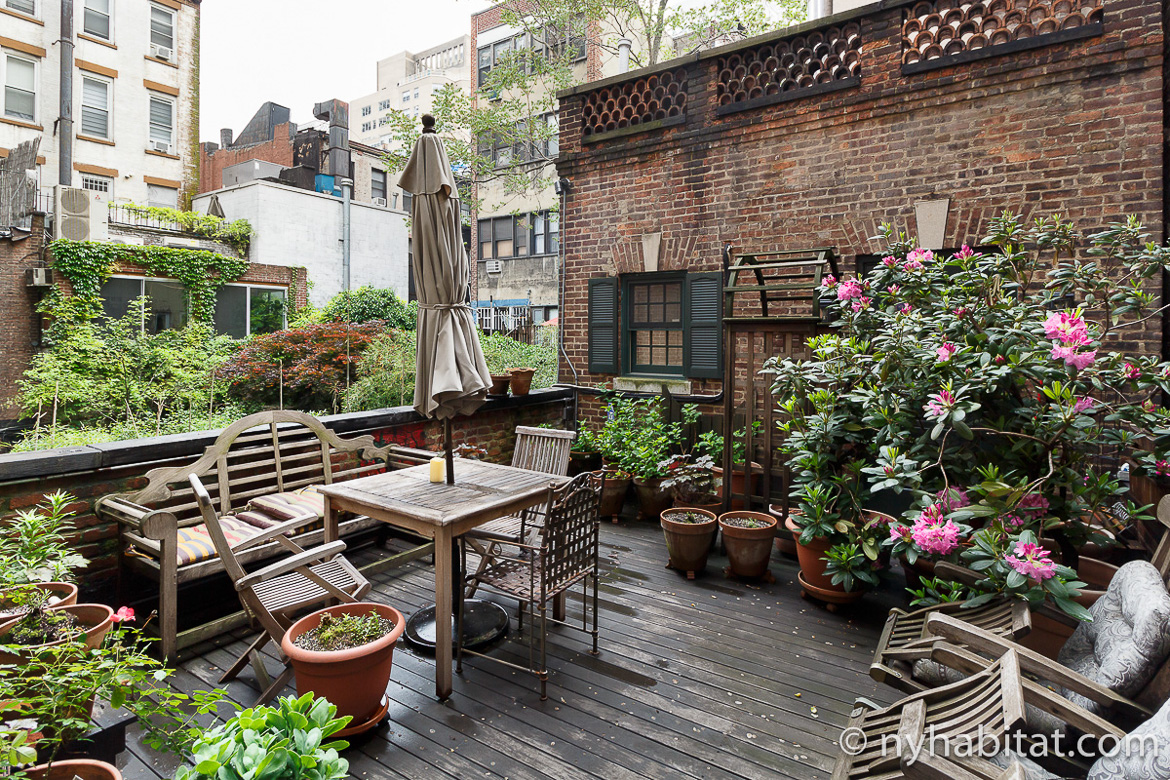 Image of private terrace at NY-17536 with patio furniture and potted plants