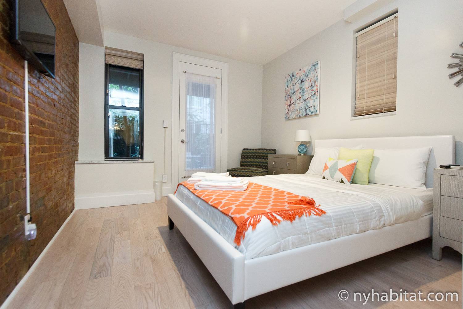Image of bedroom in NY-16635 with full-sized bed and television.