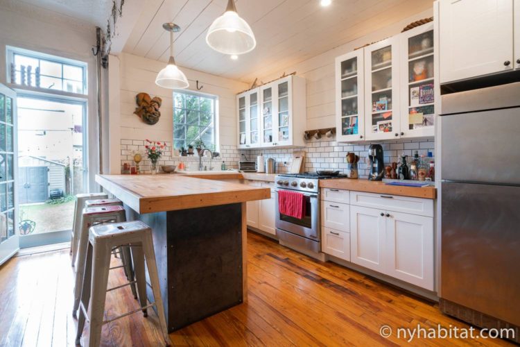 8-ways-ultimate-Thanksgiving-guide-NYC-NY-17687-Ridgewood-apartment-kitchen Image of kitchen in NY-17687 with appliances and barstool seating.