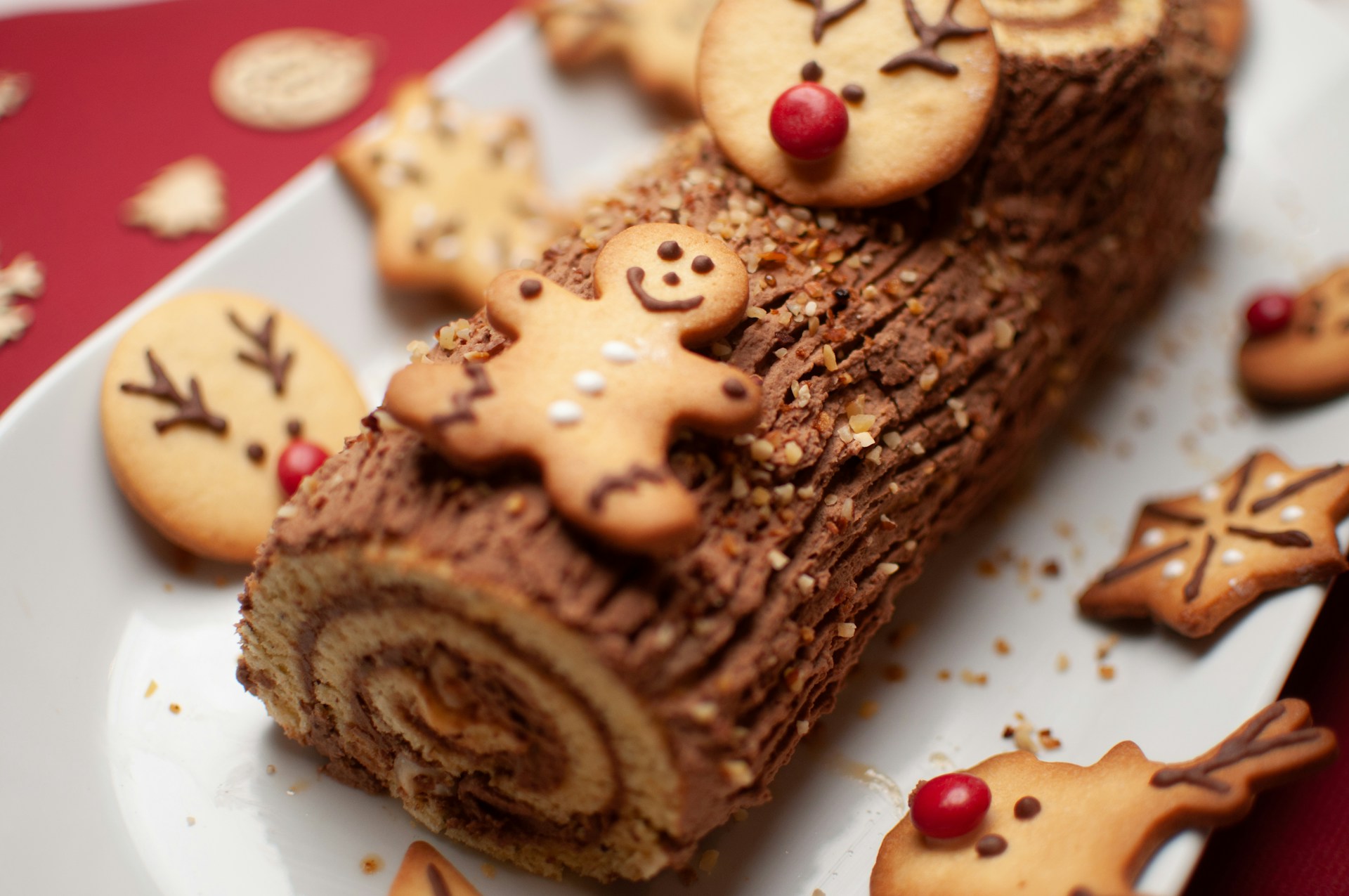 A yummy bûche de Noël cake is the pièce de résistance of a French Reveillon celebration! (Photo credit: Kisoulou via Unsplash)