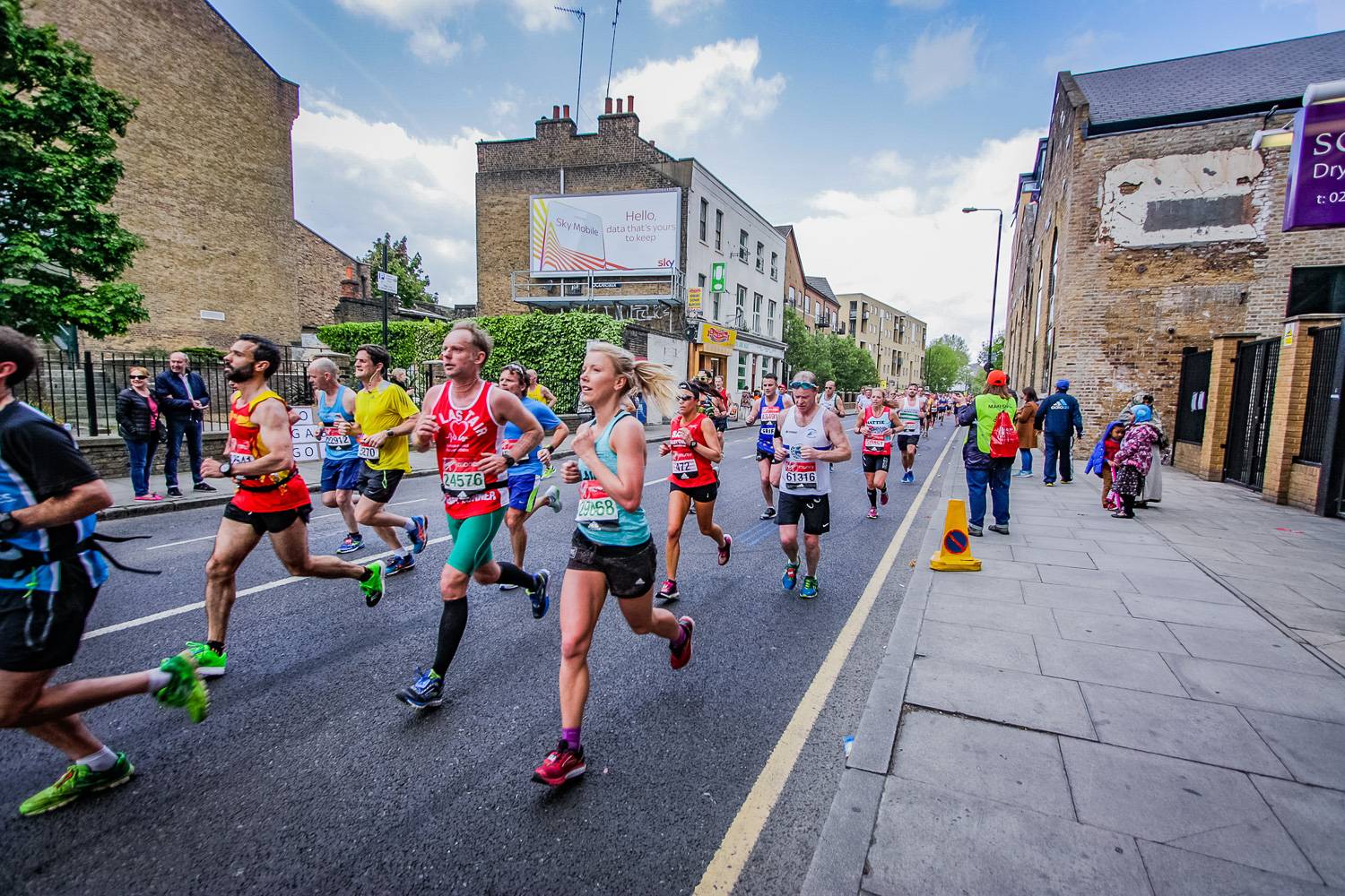 Image of runners racing the route of the London Marathon.