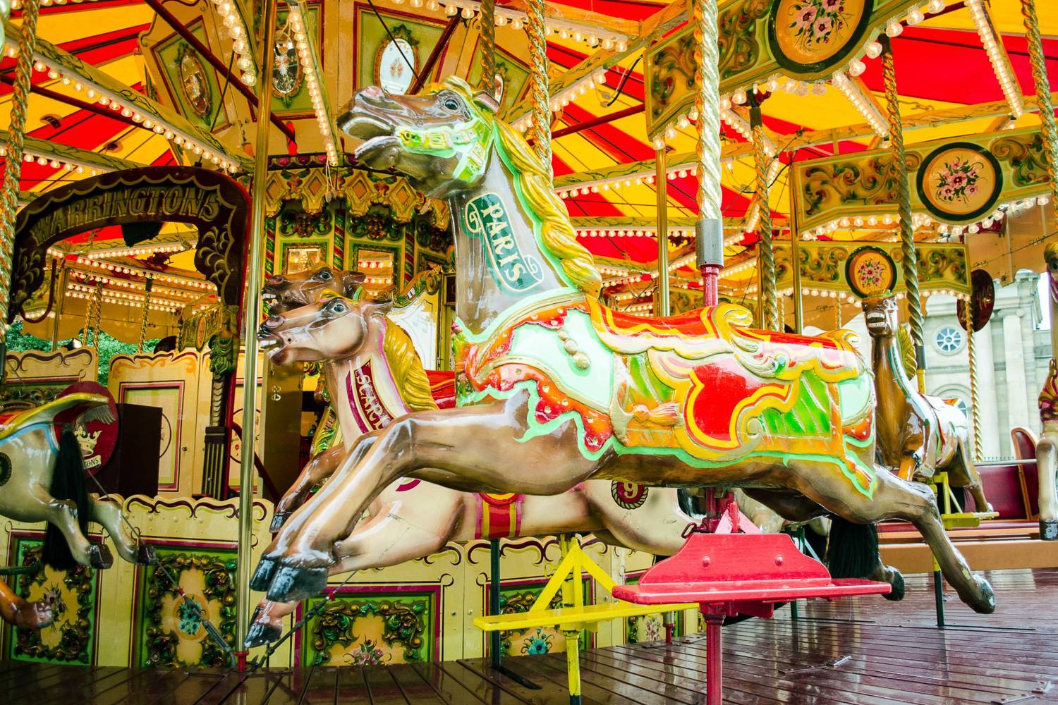 Image of carousel horses at a carnival.