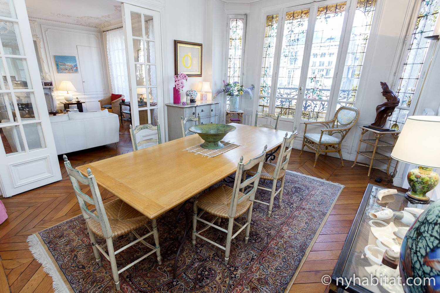 Image of dining area of PA-2623 with table and chairs.