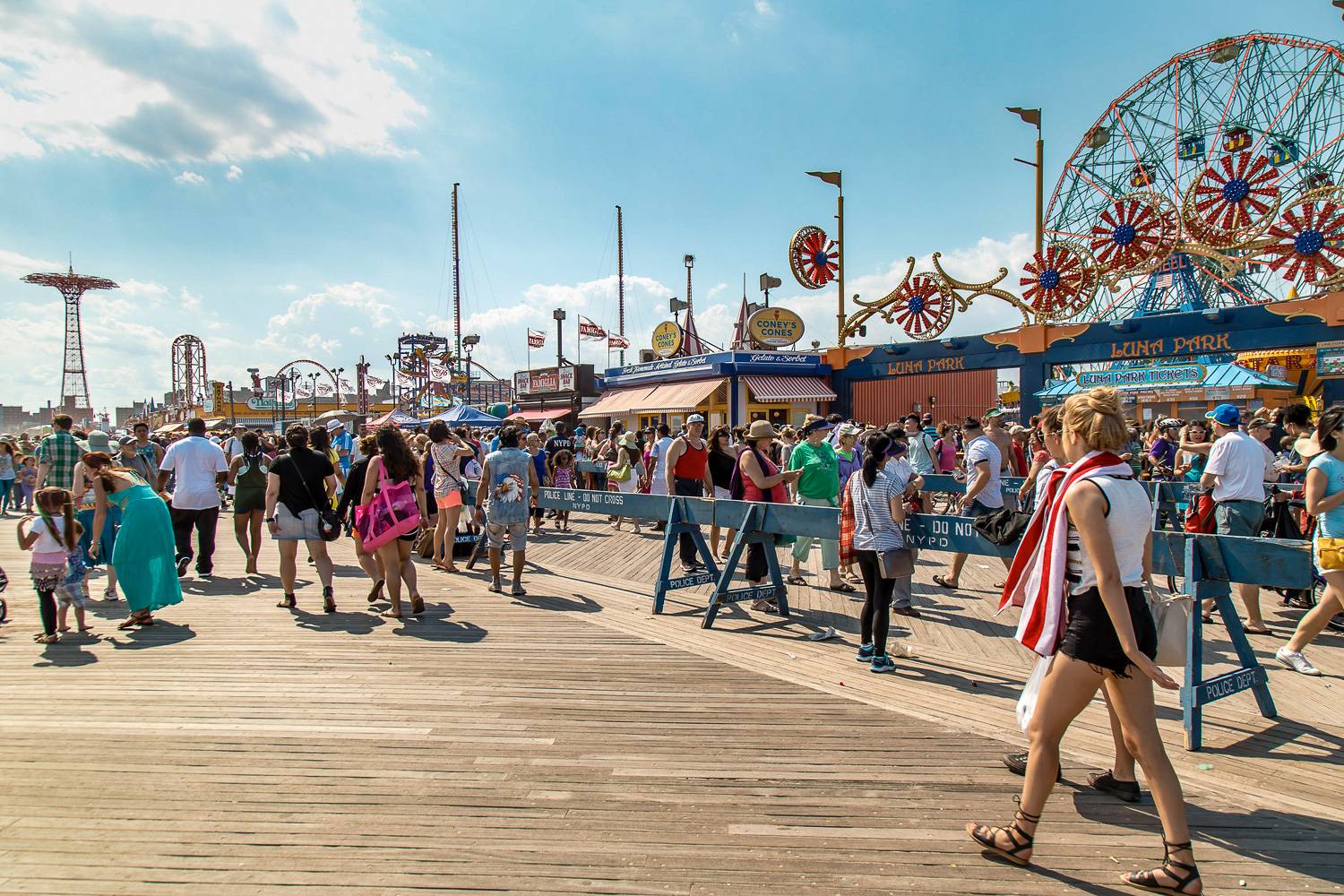 Image of crowds on the Coney Island boardwalk.
