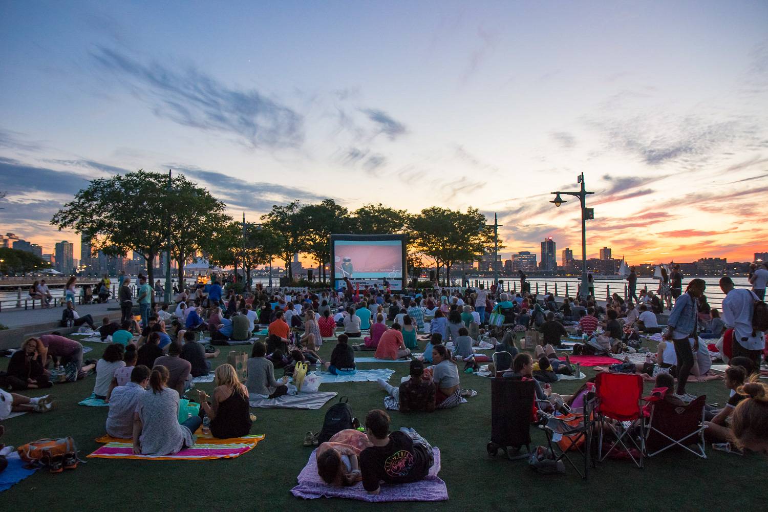 Image of outdoor film screening at Hudson River Park at dusk