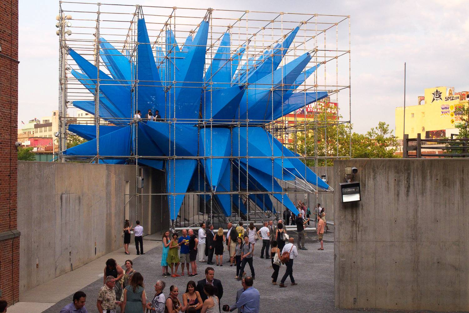 Image of rooftop of MoMA PS1 with blue sculpture.