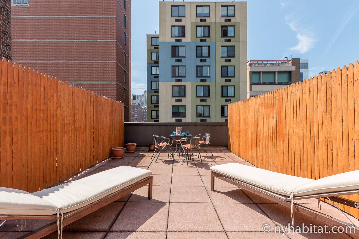 Image of rooftop of NY-12219 with lounge chairs.