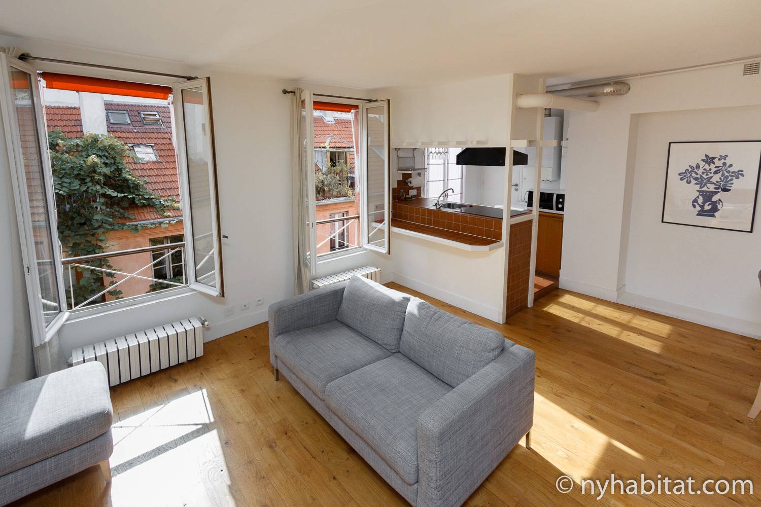 Image of living area of PA-4399 with grey couch.